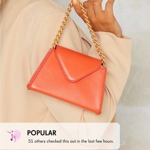 Mini orange bag with gold chain from PLT